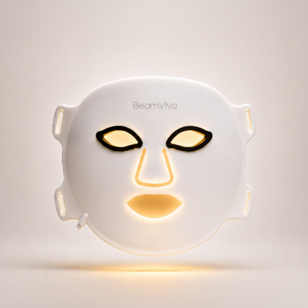BeamViva LED face mask with amber 590nm light therapy glowing warm gold
