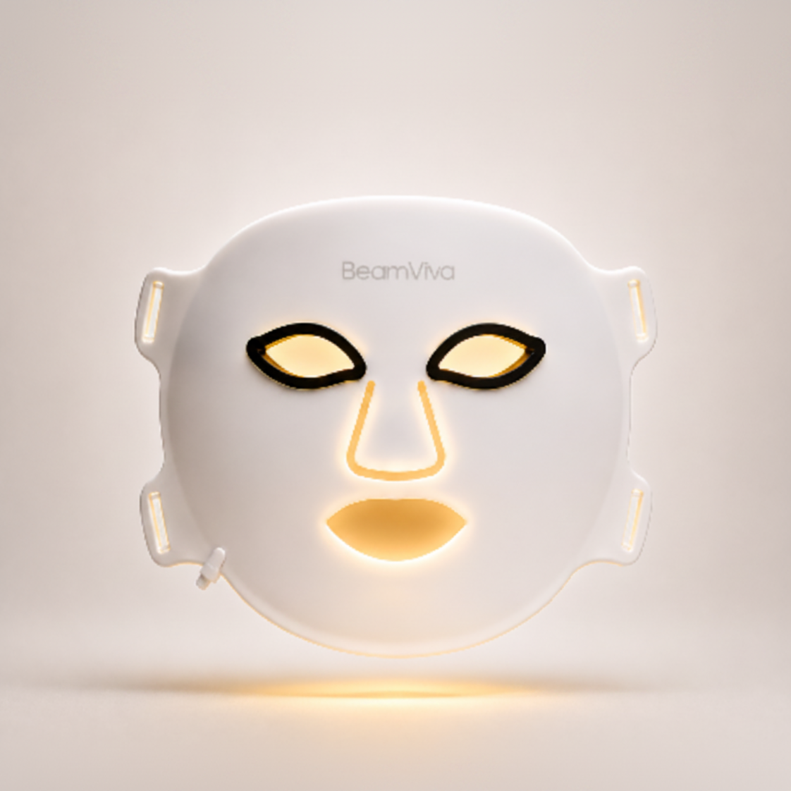 BeamViva LED face mask with amber 590nm light therapy glowing warm gold